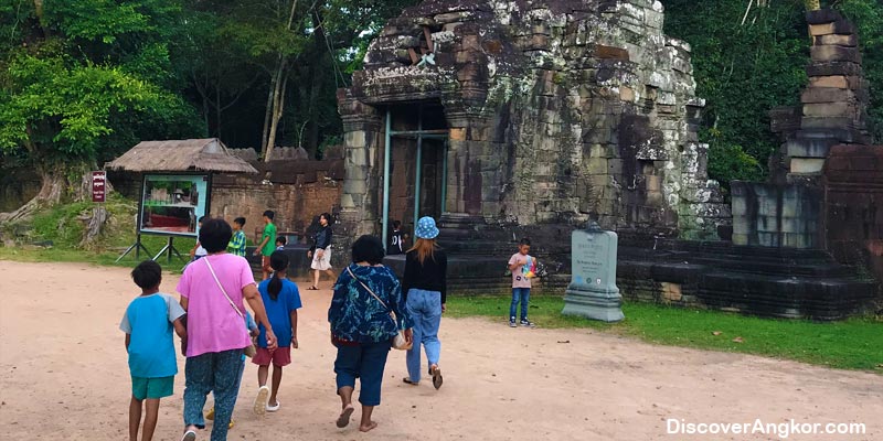 group of people walking in Angkor Wat